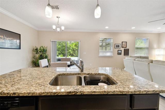 2409 Martins Run, Tavares, FL 32778 - kitchen featuring open floor plan, crown molding, healthy amount of natural light, dishwasher, and light stone counters