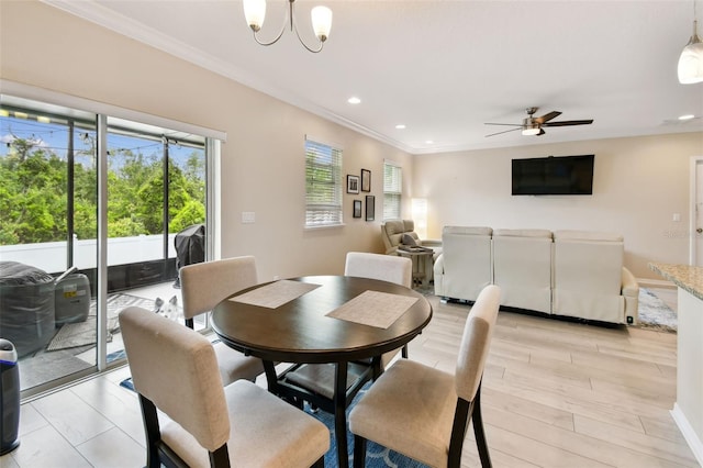 2409 Martins Run, Tavares, FL 32778 - dining area with crown molding, ceiling fan, recessed lighting, and a chandelier