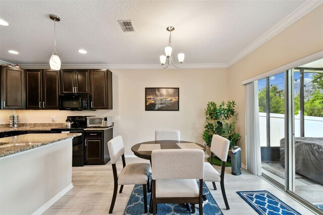 2409 Martins Run, Tavares, FL 32778 - dining space featuring crown molding, light wood-style floors, recessed lighting, and a chandelier