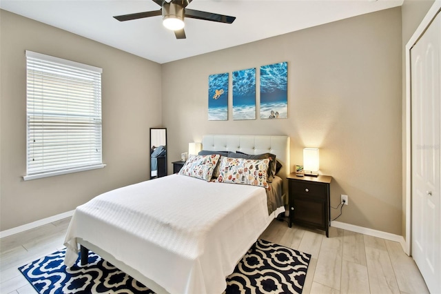 2409 Martins Run, Tavares, FL 32778 - bedroom with a closet, light wood finished floors, and a ceiling fan
