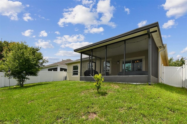 2409 Martins Run, Tavares, FL 32778 - back of house with a sunroom, a fenced backyard, and stucco siding