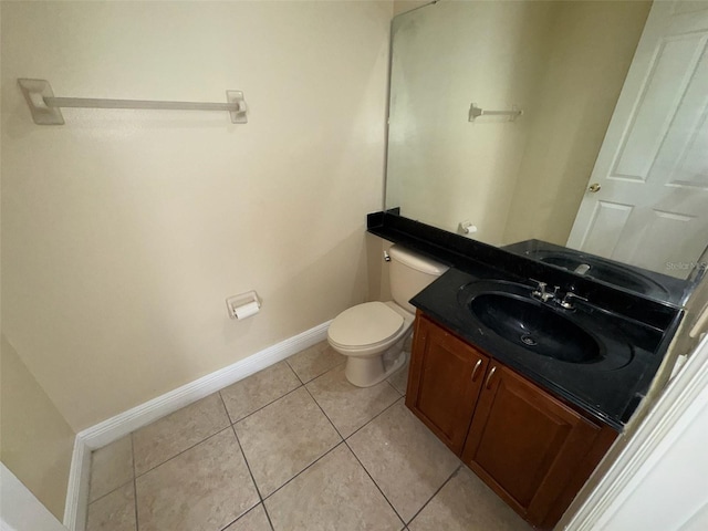 14508 Cedar Branch Way, Orlando, FL 32824 - half bathroom with baseboards, toilet, tile patterned floors, and vanity