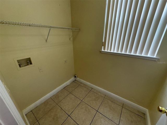 14508 Cedar Branch Way, Orlando, FL 32824 - washroom featuring hookup for a washing machine, baseboards, and light tile patterned floors