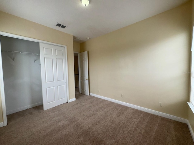14508 Cedar Branch Way, Orlando, FL 32824 - unfurnished bedroom featuring carpet flooring, baseboards, and a closet