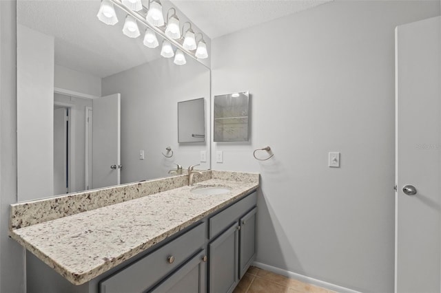 5436 E Michigan St Unit 7, Orlando, FL 32812 - bathroom featuring vanity, tile patterned flooring, and a textured ceiling