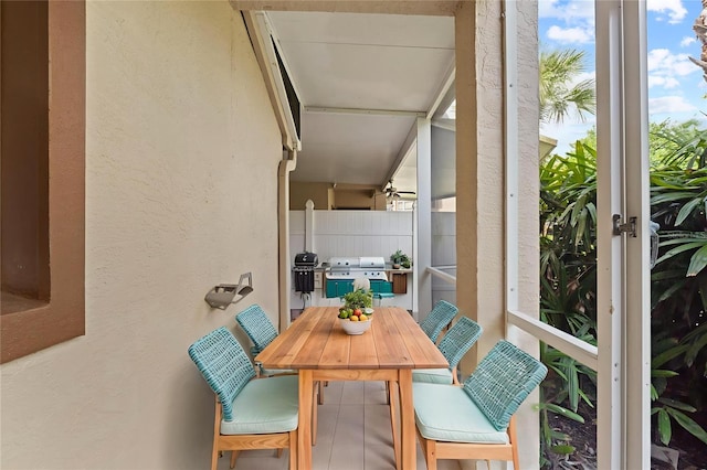5436 E Michigan St Unit 7, Orlando, FL 32812 - balcony featuring grilling area and outdoor dining space