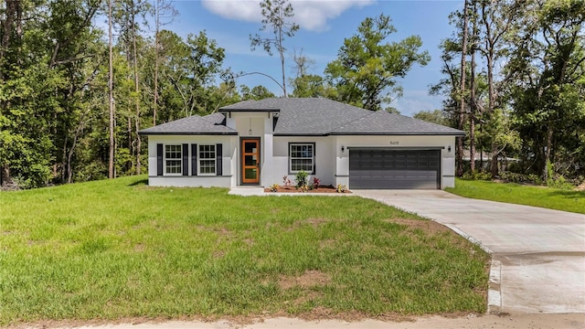 9419 N Jackson Way, Citrus Springs, FL 34434 - prairie-style home with stucco siding, a garage, concrete driveway, a front lawn, and roof with shingles