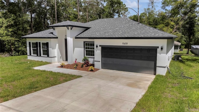 9419 N Jackson Way, Citrus Springs, FL 34434 - view of front facade with roof with shingles, stucco siding, a garage, and a front yard