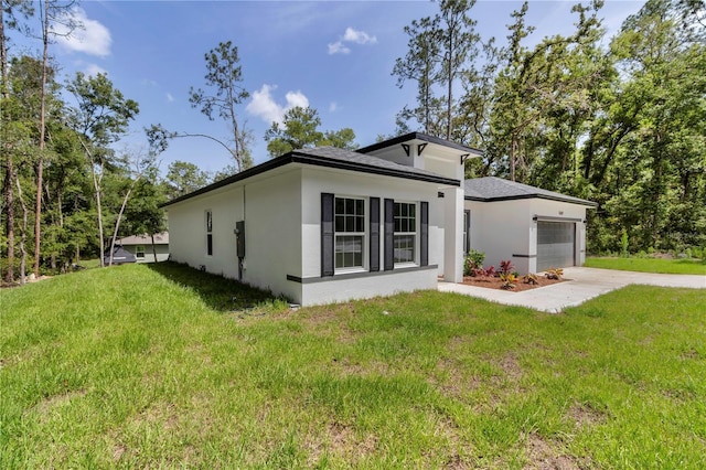 9419 N Jackson Way, Citrus Springs, FL 34434 - view of front of house with stucco siding, a front lawn, driveway, and a garage