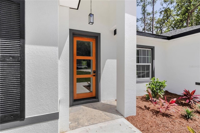 9419 N Jackson Way, Citrus Springs, FL 34434 - view of exterior entry featuring stucco siding