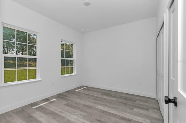 9419 N Jackson Way, Citrus Springs, FL 34434 - unfurnished bedroom featuring wood finished floors and baseboards