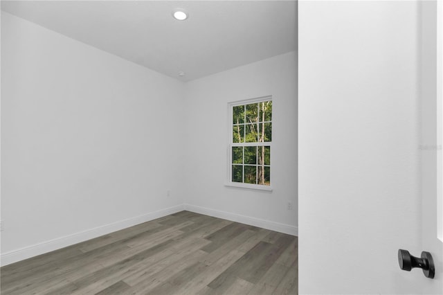 9419 N Jackson Way, Citrus Springs, FL 34434 - unfurnished room with wood finished floors, baseboards, and recessed lighting
