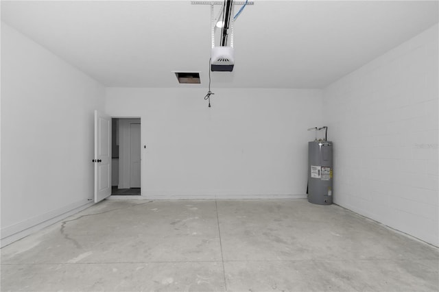 9419 N Jackson Way, Citrus Springs, FL 34434 - garage featuring electric water heater and a garage door opener