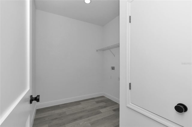 9419 N Jackson Way, Citrus Springs, FL 34434 - laundry area with wood finished floors, baseboards, and washer hookup
