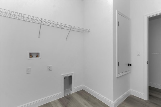 9419 N Jackson Way, Citrus Springs, FL 34434 - laundry room with hookup for an electric dryer, hookup for a washing machine, dark wood-style flooring, and baseboards