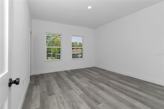 9419 N Jackson Way, Citrus Springs, FL 34434 - unfurnished room featuring wood finished floors, baseboards, and recessed lighting