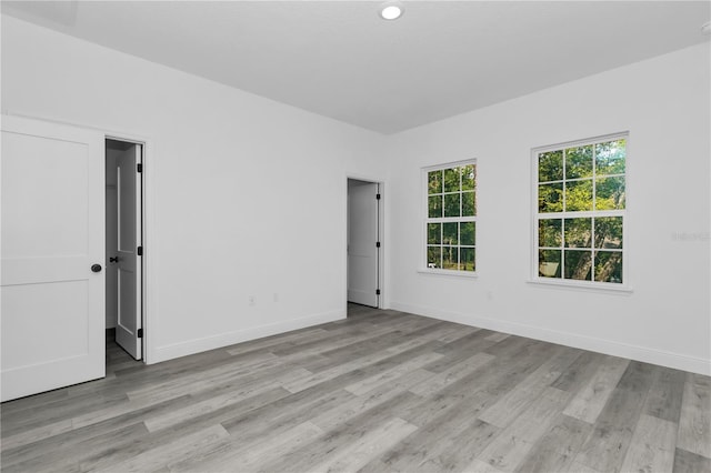9419 N Jackson Way, Citrus Springs, FL 34434 - unfurnished room featuring light wood finished floors and baseboards