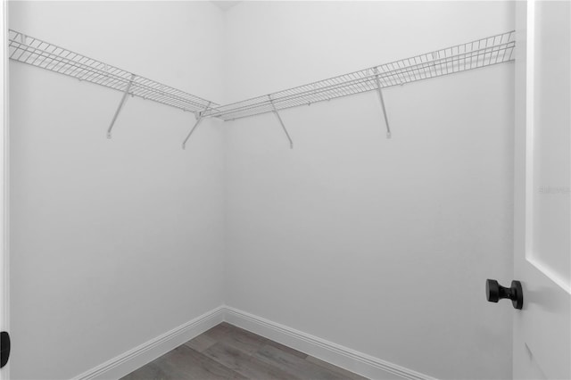 9419 N Jackson Way, Citrus Springs, FL 34434 - spacious closet featuring dark wood-type flooring