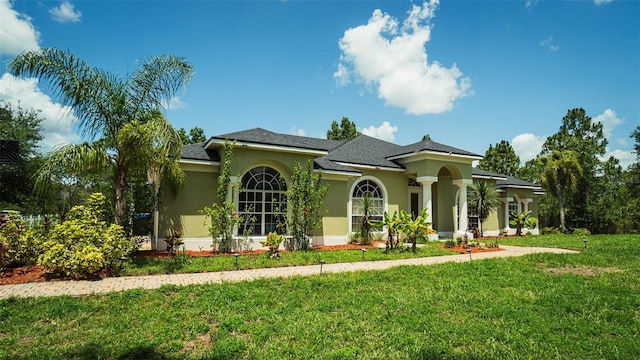 19951 Quinlan St, Orlando, FL 32833 - mediterranean / spanish-style home with stucco siding and a front lawn