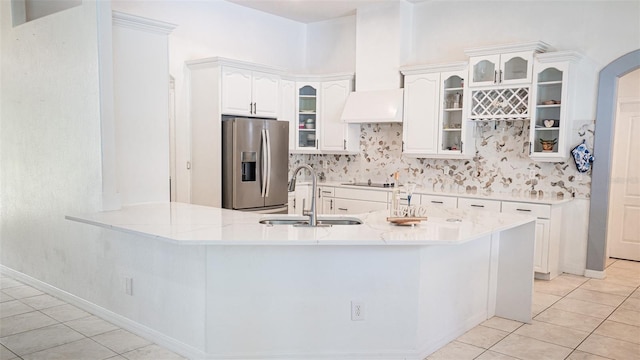 19951 Quinlan St, Orlando, FL 32833 - kitchen featuring stainless steel fridge, light tile patterned floors, tasteful backsplash, and a peninsula