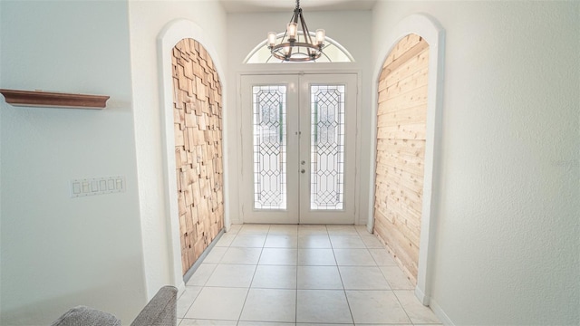 19951 Quinlan St, Orlando, FL 32833 - entrance foyer with french doors, a chandelier, and light tile patterned flooring