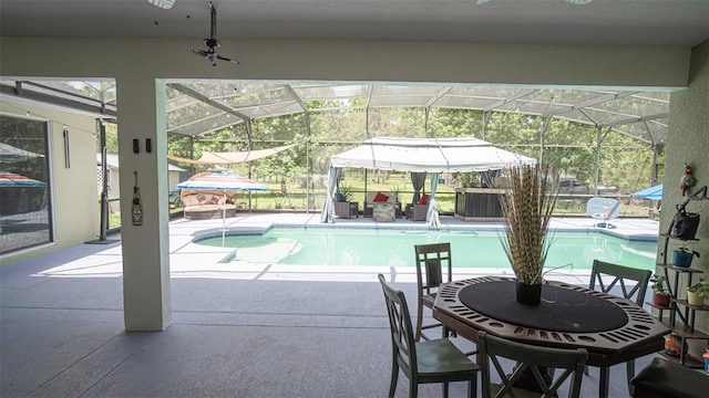 19951 Quinlan St, Orlando, FL 32833 - outdoor pool with ceiling fan, a patio area, and glass enclosure