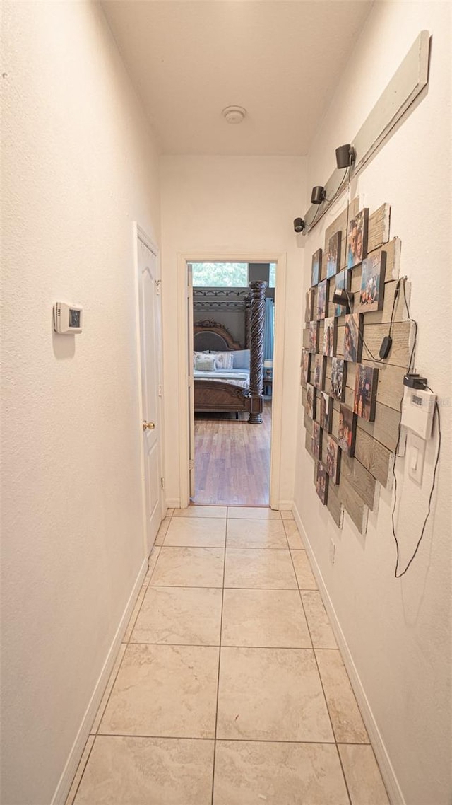 19951 Quinlan St, Orlando, FL 32833 - corridor featuring baseboards and light tile patterned floors