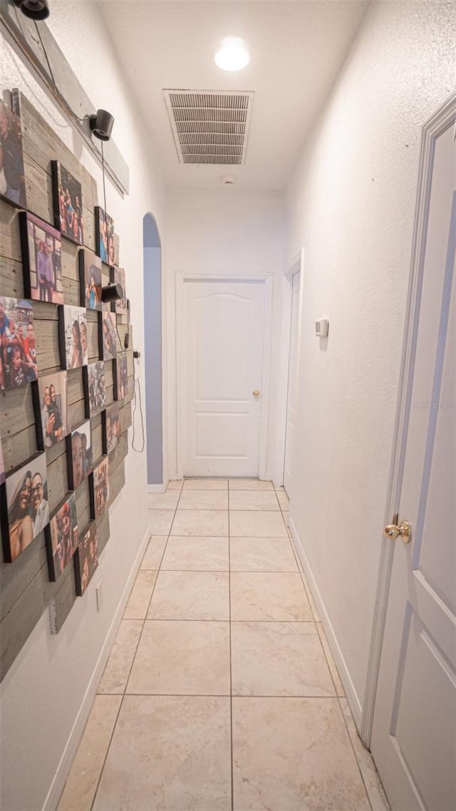 19951 Quinlan St, Orlando, FL 32833 - corridor featuring arched walkways and light tile patterned floors