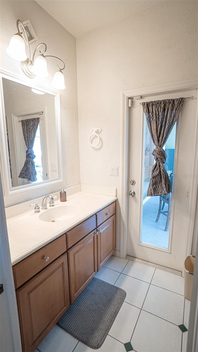 19951 Quinlan St, Orlando, FL 32833 - bathroom with vanity and tile patterned floors