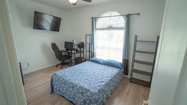 19951 Quinlan St, Orlando, FL 32833 - bedroom with light wood-type flooring, a desk, and a ceiling fan