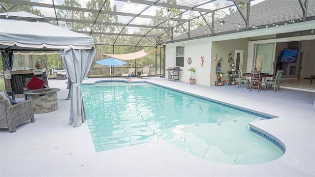 19951 Quinlan St, Orlando, FL 32833 - swimming pool with a fire pit, a patio area, and glass enclosure