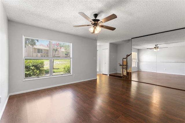 818 Park Lake Cir Unit 10, Maitland, FL 32751 - unfurnished living room featuring a ceiling fan, wood finished floors, a textured ceiling, and stairway
