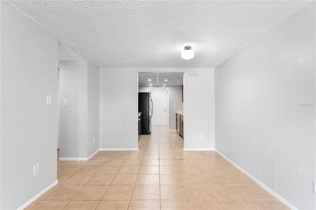 818 Park Lake Cir Unit 10, Maitland, FL 32751 - spare room featuring light tile patterned flooring and a textured ceiling