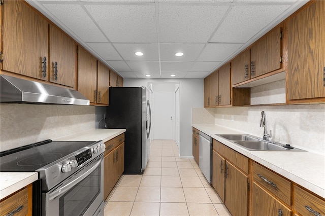 818 Park Lake Cir Unit 10, Maitland, FL 32751 - kitchen with stainless steel appliances, under cabinet range hood, light countertops, brown cabinets, and recessed lighting