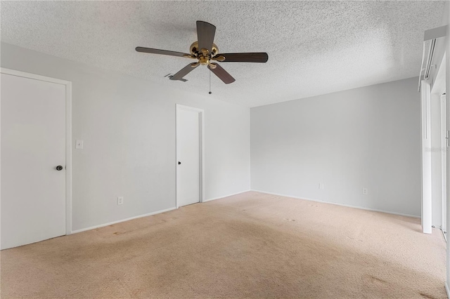 818 Park Lake Cir Unit 10, Maitland, FL 32751 - unfurnished bedroom featuring carpet flooring, a textured ceiling, and a ceiling fan