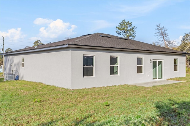 178 Marion Oaks Ln, Ocala, FL 34473 - back of house featuring a yard, a shingled roof, stucco siding, a patio, and central AC
