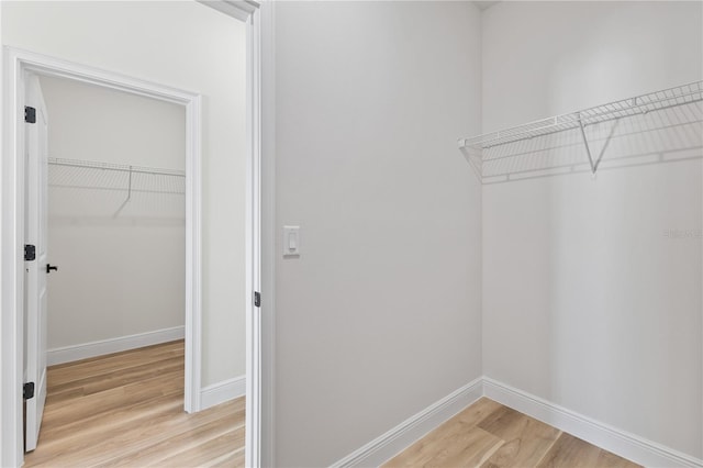 178 Marion Oaks Ln, Ocala, FL 34473 - spacious closet with light wood finished floors