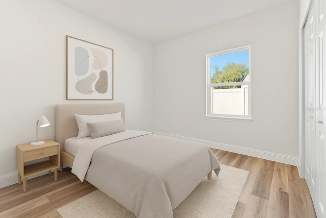 178 Marion Oaks Ln, Ocala, FL 34473 - bedroom featuring light wood-style floors and baseboards