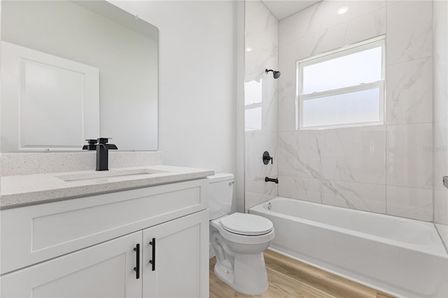 178 Marion Oaks Ln, Ocala, FL 34473 - full bathroom with toilet, vanity, wood finished floors, and washtub / shower combination