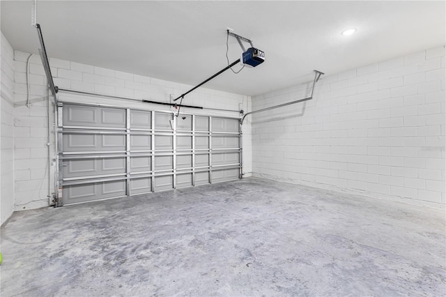 178 Marion Oaks Ln, Ocala, FL 34473 - garage with a garage door opener and concrete block wall