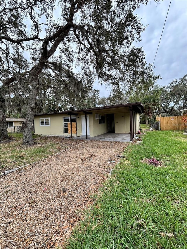 5026 Osprey Ln, New Port Richey, FL 34652 - view of front of home featuring driveway and a carport