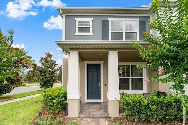 11054 Hanlon Terrace Aly, Winter Garden, FL 34787 - view of front of home featuring stucco siding and a porch