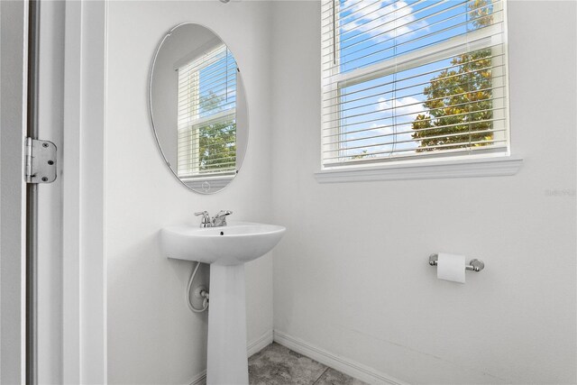 11054 Hanlon Terrace Aly, Winter Garden, FL 34787 - bathroom with a sink, tile patterned flooring, and baseboards