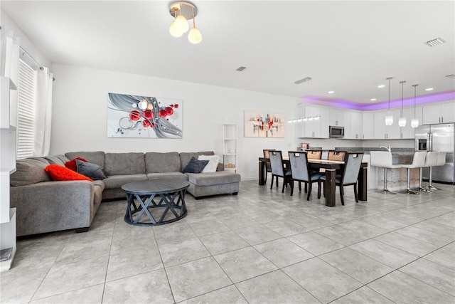 11054 Hanlon Terrace Aly, Winter Garden, FL 34787 - living room featuring light tile patterned floors and recessed lighting