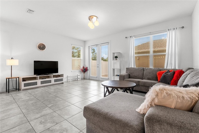 11054 Hanlon Terrace Aly, Winter Garden, FL 34787 - living room with light tile patterned floors and plenty of natural light