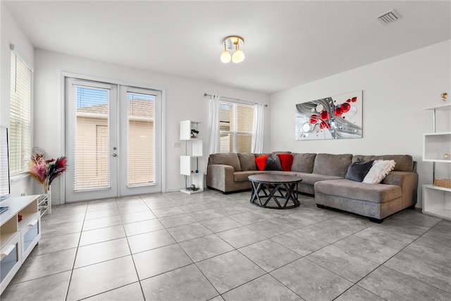 11054 Hanlon Terrace Aly, Winter Garden, FL 34787 - living area with french doors and light tile patterned floors