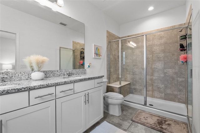 11054 Hanlon Terrace Aly, Winter Garden, FL 34787 - full bathroom featuring double vanity, toilet, a stall shower, and tile patterned floors