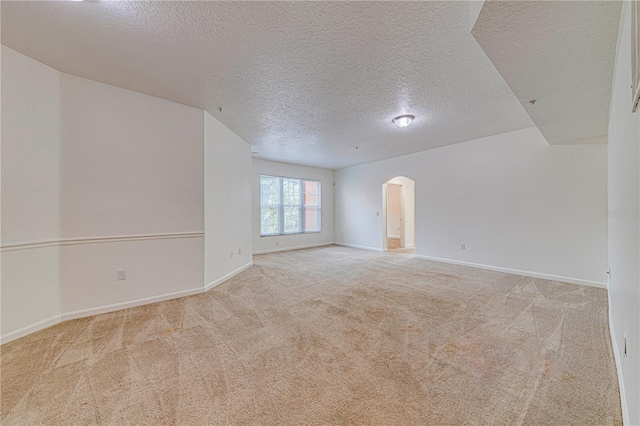 5500 Metrowest Blvd Unit 203, Orlando, FL 32811 - carpeted spare room with arched walkways, a textured ceiling, and baseboards