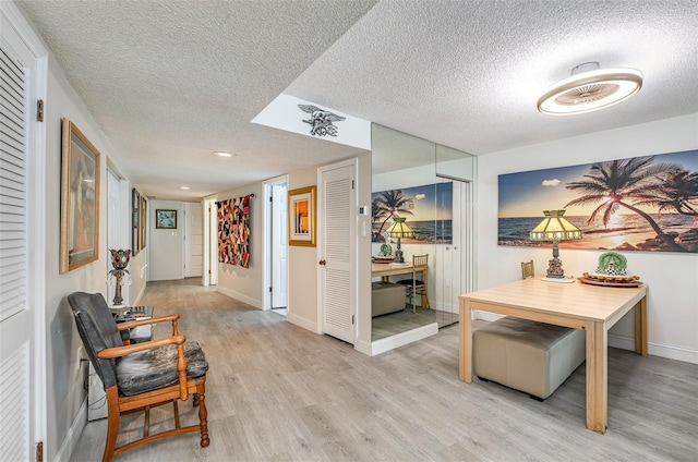 4850 Ocean Beach Blvd Unit 208, Cocoa Beach, FL 32931 - interior space featuring a textured ceiling, wood finished floors, baseboards, and recessed lighting