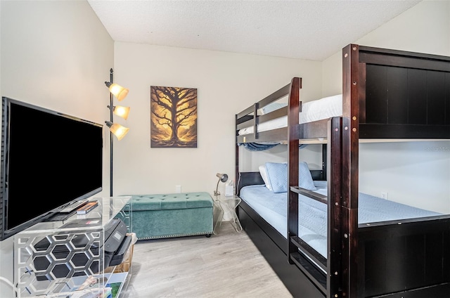 4850 Ocean Beach Blvd Unit 208, Cocoa Beach, FL 32931 - bedroom with wood finished floors